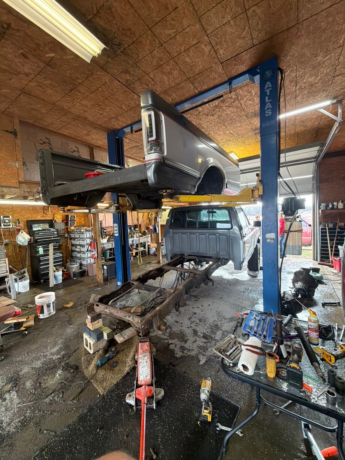 Truck on Atlas 4-post lift at TP Customs LLC shop