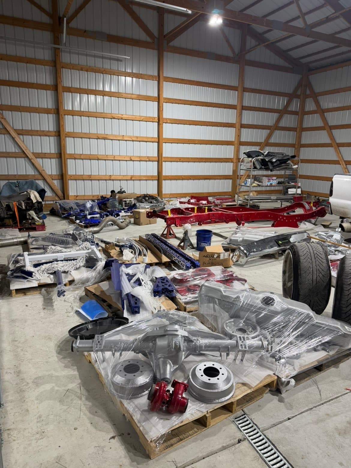 TP Customs LLC shop interior with red frame build in progress